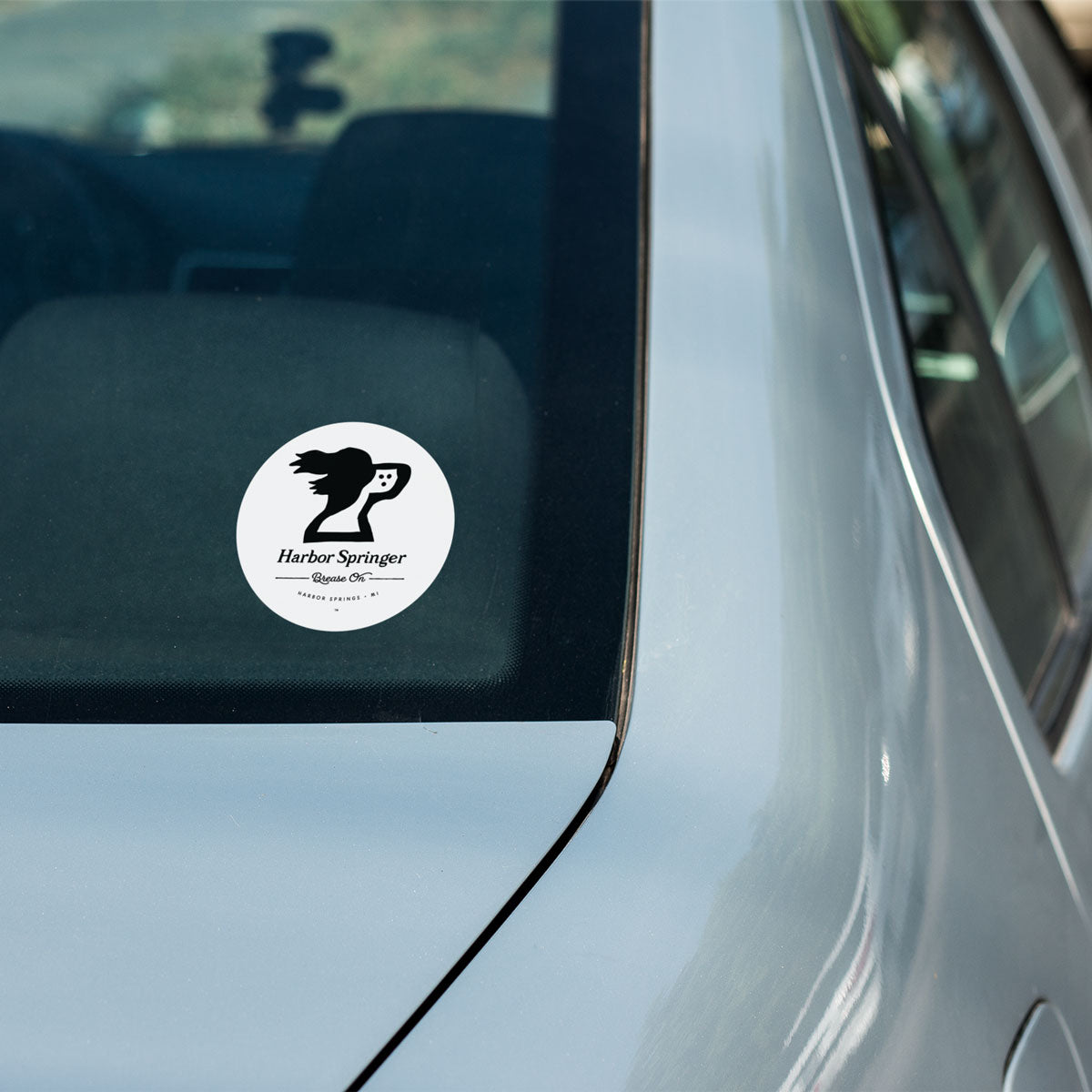 Springer spaniel dog logo on a round sticker for Harbor Springer™ the brand of Sophistichillaxation.