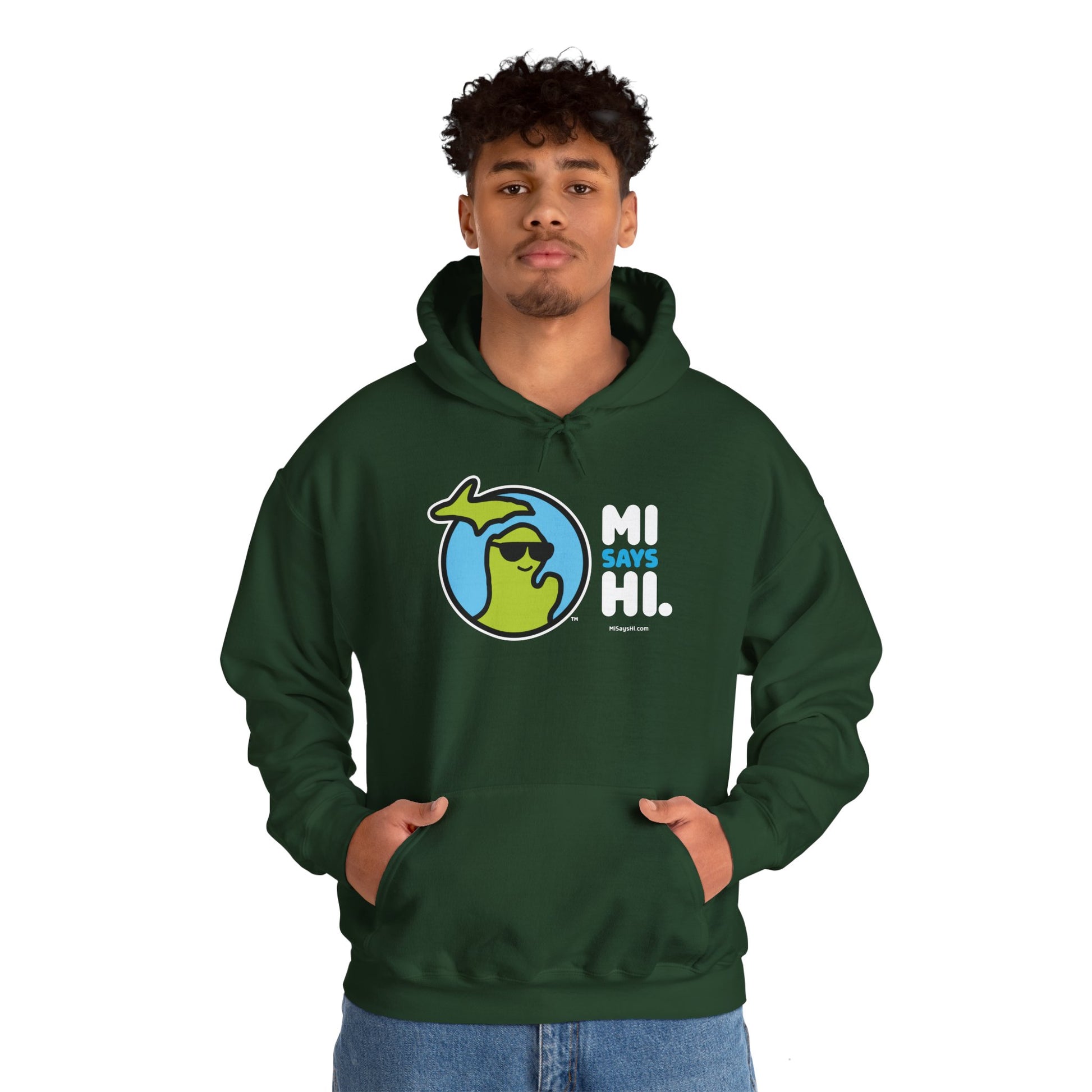 Man wearing a green hoodie with waving Michigan logo wearing sunglasses and smiling for the MI Says Hi brand.