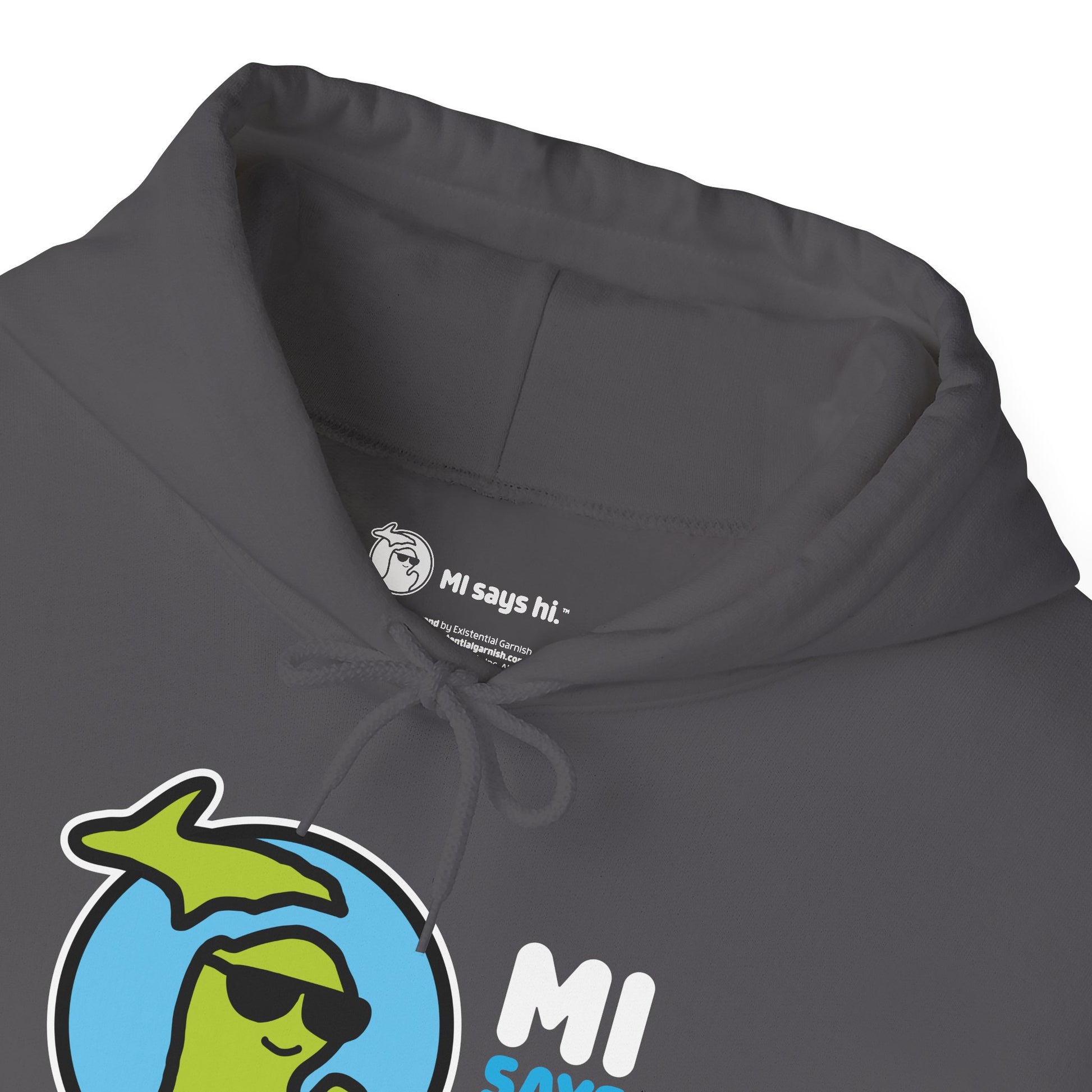 Closeup of neck label of a gray hoodie with waving Michigan logo wearing sunglasses and smiling for the MI Says Hi brand.