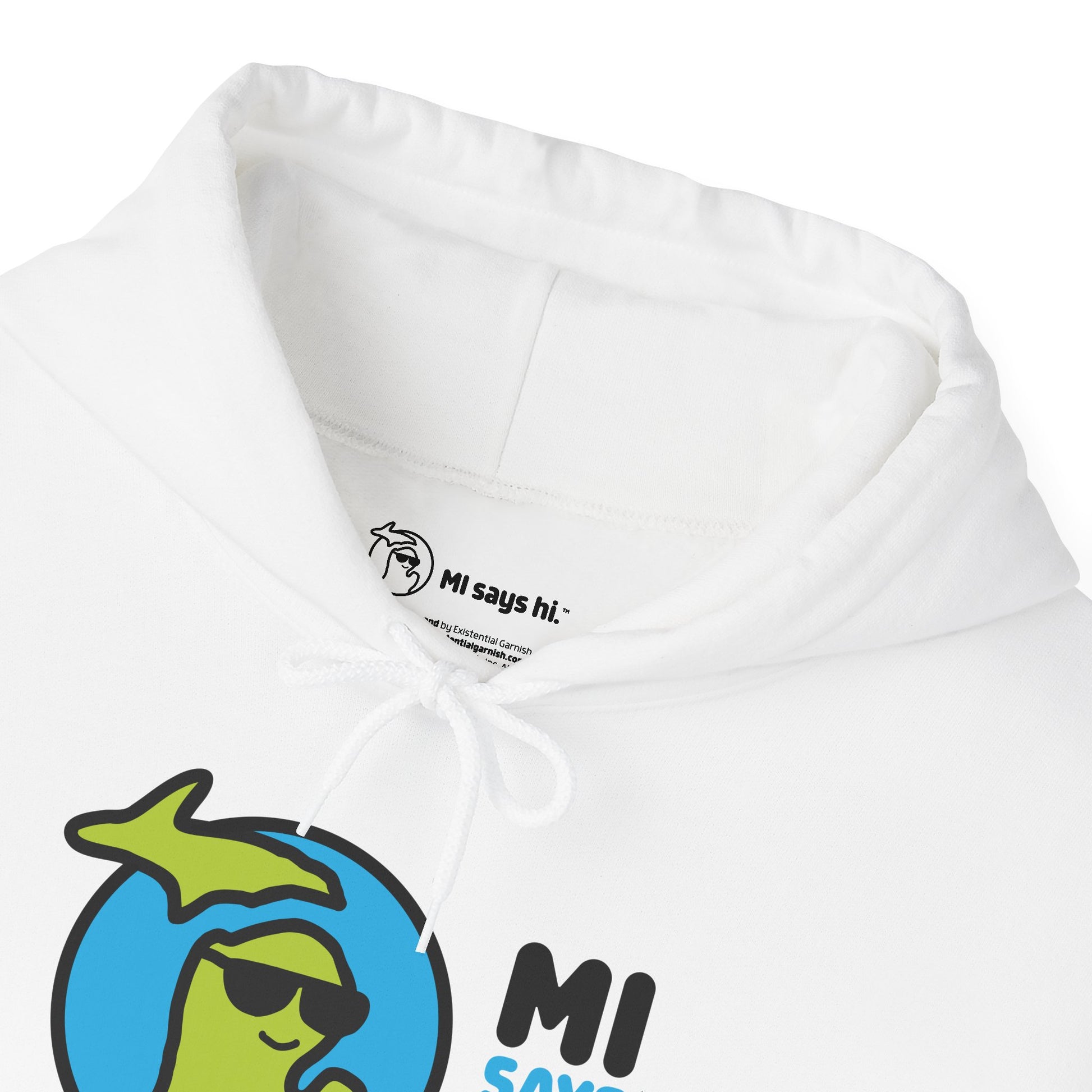 Closeup of neck label of a white hoodie with waving Michigan logo wearing sunglasses and smiling for the MI Says Hi brand.