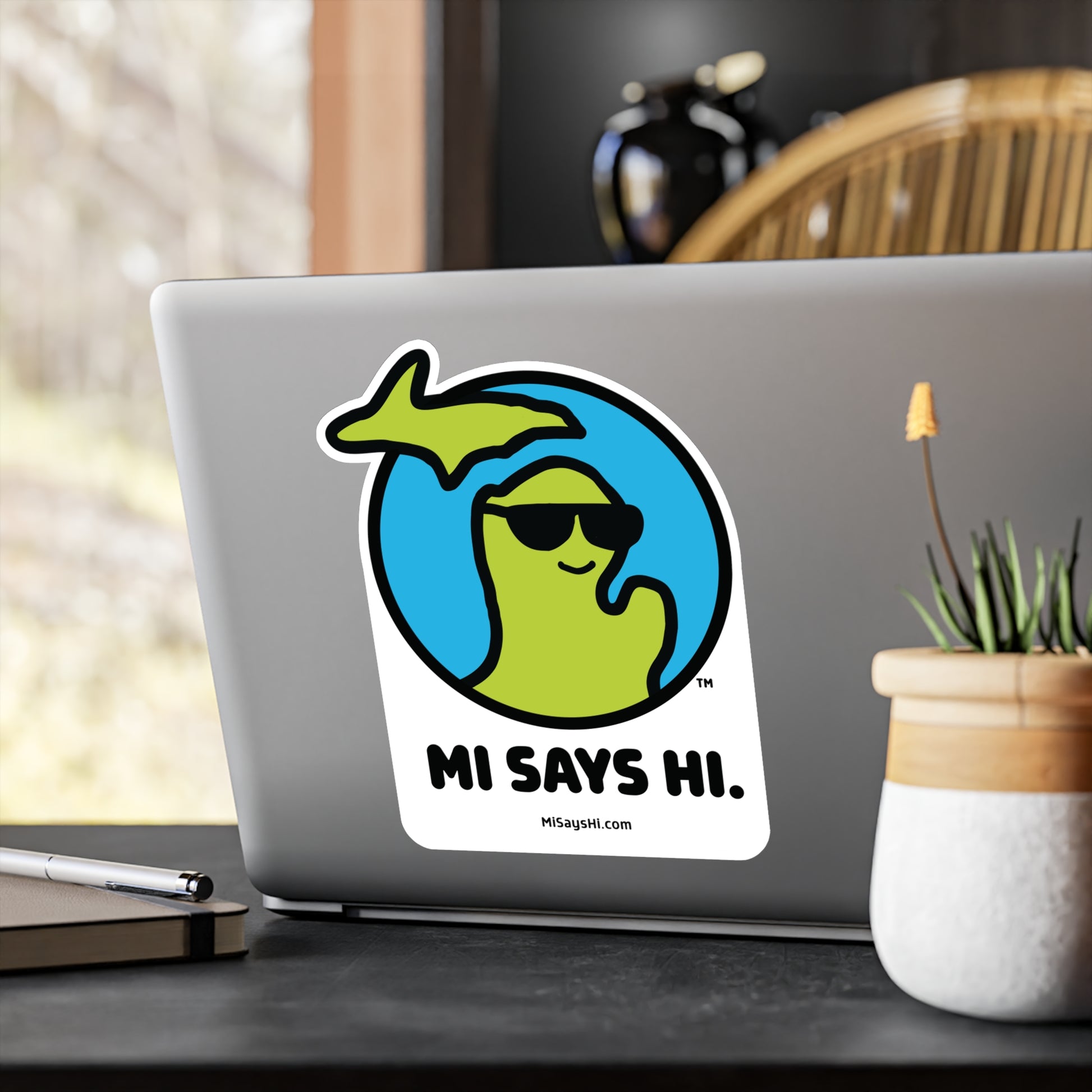 Extra large vinyl laptop sticker with waving Michigan logo wearing sunglasses.